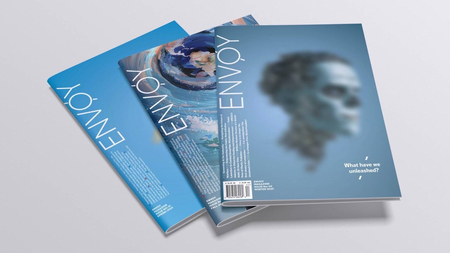 Printed issues of Envoy Magazine, including Issue 03, Winter 2025.